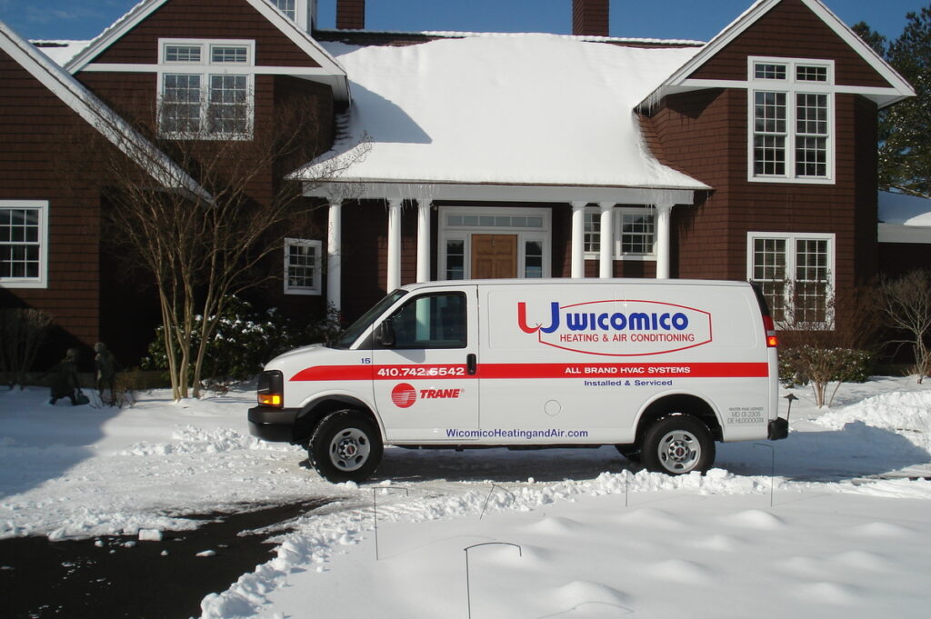 Wicomico van infront of snowy home - center aligned