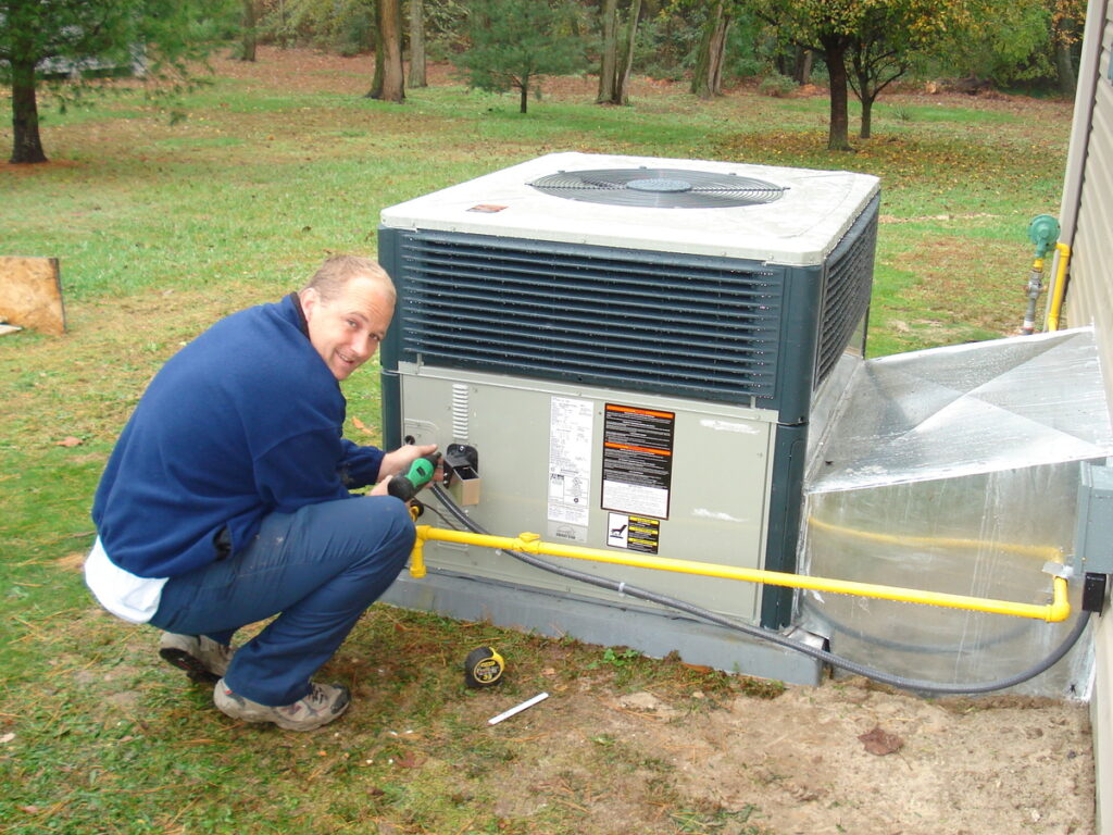 Wicomico tech working on outdoor ac unit